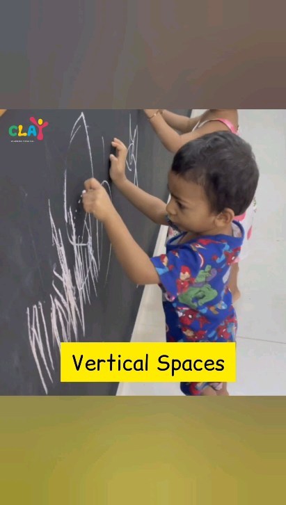 At Clay Montessori, we understand the importance of providing ample opportunities for toddlers to explore vertical spaces for writing. We create an environment that fosters creativity and learning by offering various vertical writing surfaces, such as easels and chalkboards, as integral parts of our curriculum.

Writing on vertical spaces, like easels or chalkboards, can offer several benefits for toddlers:

Fine motor skill development: Holding a crayon or chalk and making marks on a vertical surface helps toddlers refine their fine motor skills, improving hand-eye coordination and grip strength.

Arm and shoulder strength: Engaging in vertical writing activities requires toddlers to use their arm and shoulder muscles, promoting overall upper body strength.

Handwriting readiness: Practicing on a vertical surface can help toddlers prepare for future handwriting skills by promoting proper hand positioning and control.

Spatial awareness: Working on a vertical space encourages toddlers to become more aware of space and size, as they need to adjust their movements accordingly.

Creativity and imagination: The vertical surface provides a larger canvas for toddlers to explore and express their creativity, fostering imaginative play and artistic development.

Cognitive development: Drawing and writing on a vertical surface can enhance cognitive skills such as problem-solving, concentration, and memory.

Physical activity: Engaging in vertical writing activities can be a form of physical exercise for toddlers.
#claymontessori #preparedenvironment #montessori #writing #preschools #mumbai #Matunga #Dadar #sion #parel # toddlers #prewriting #prewritingskills